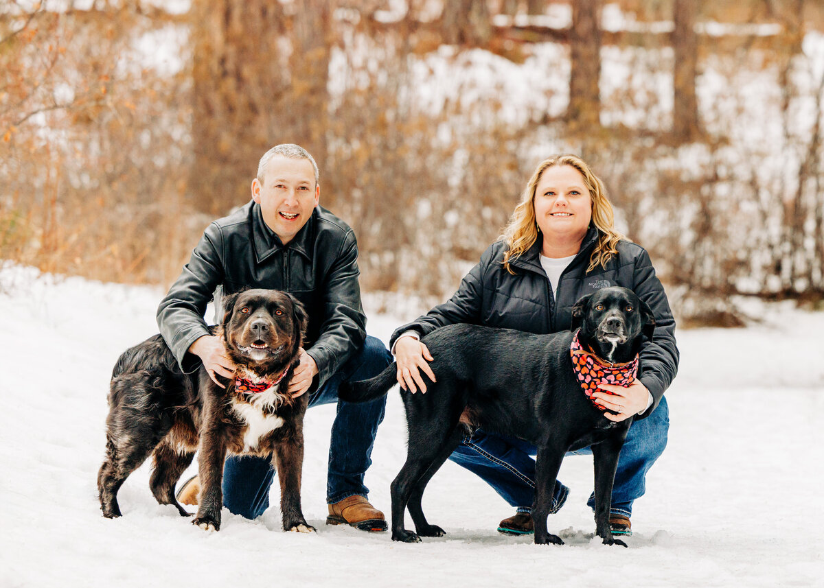 Winter engagement photo of couple with dogs in Pattee Canyon, Missoula