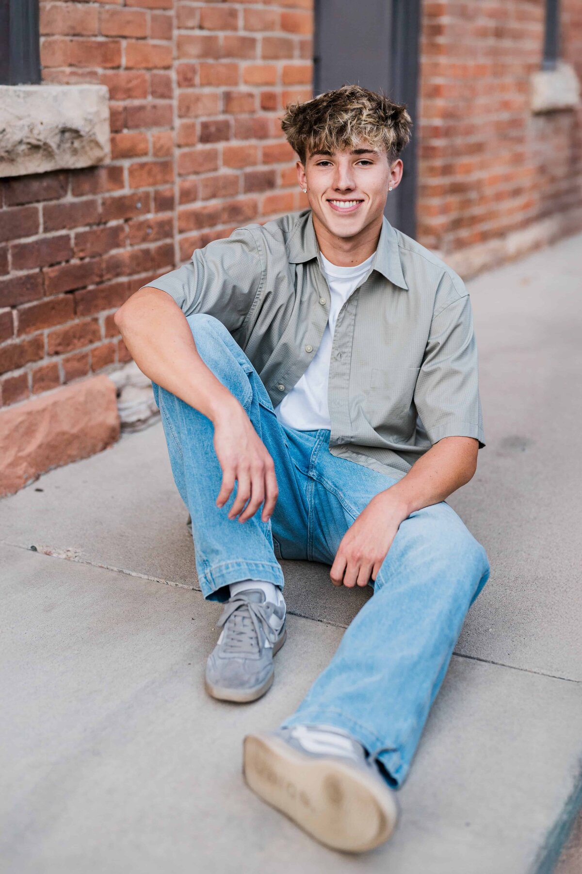 Graduating high school senior has a downtown Fort Collins, Colorado senior photo session with senior photographer Avenir Photo Co.