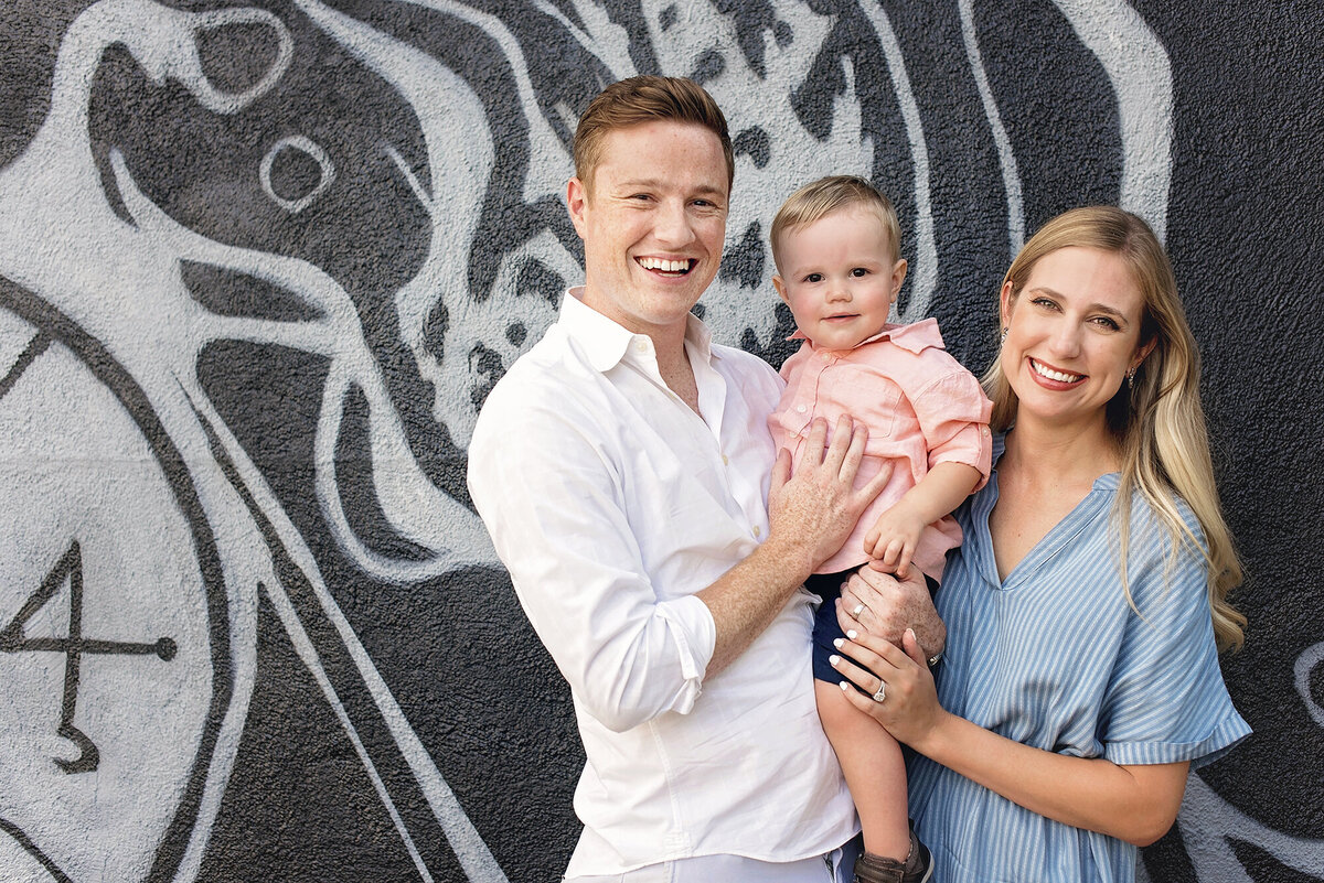 Graphic and artistic backdrop for a photo with mom, dad and little boy in RiNo, Denver.