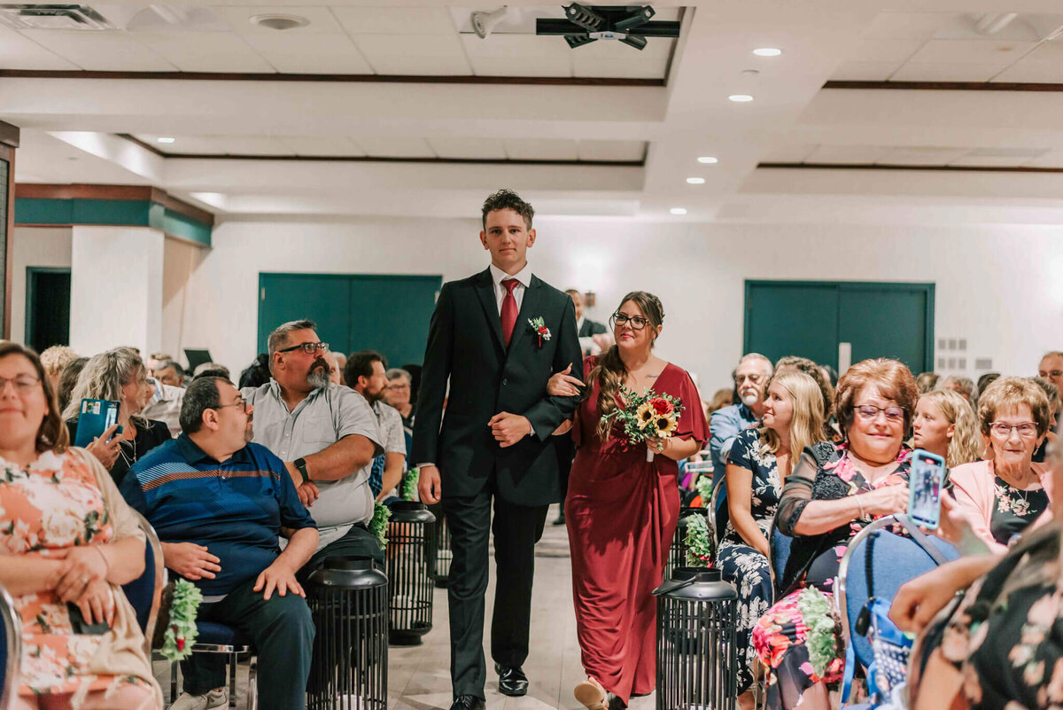 2nd bridal party walking down the aisle.