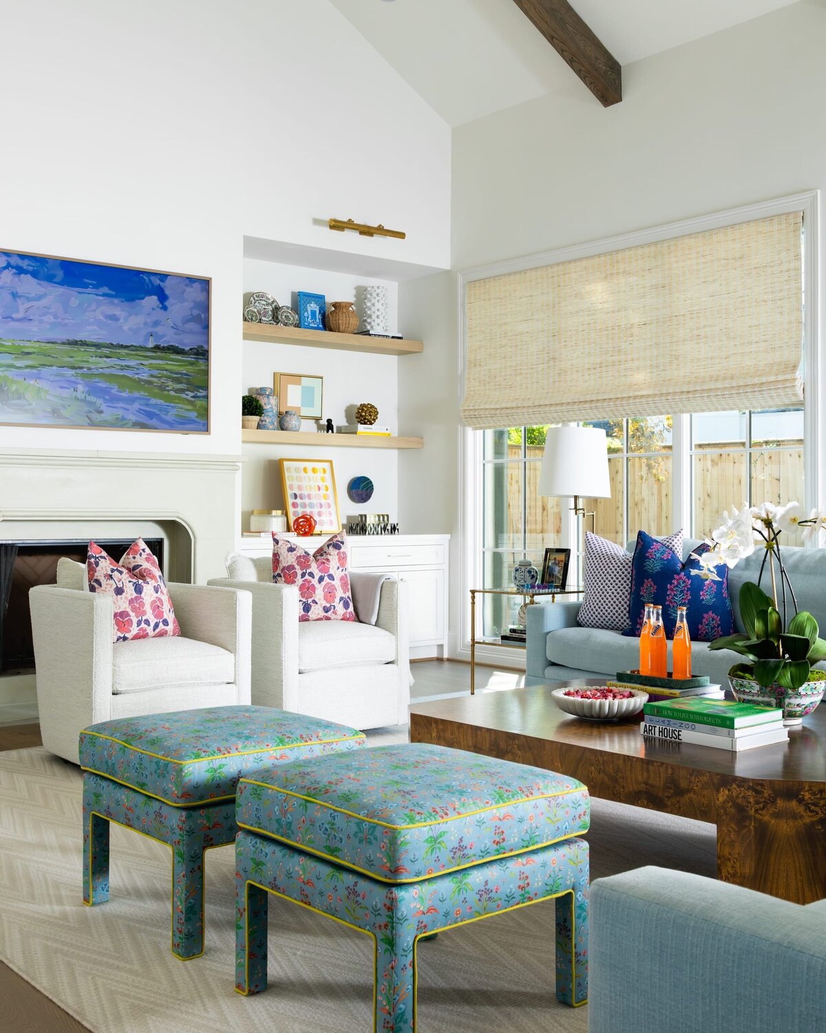 french lab designs living room with bright colors and dark wood coffee table