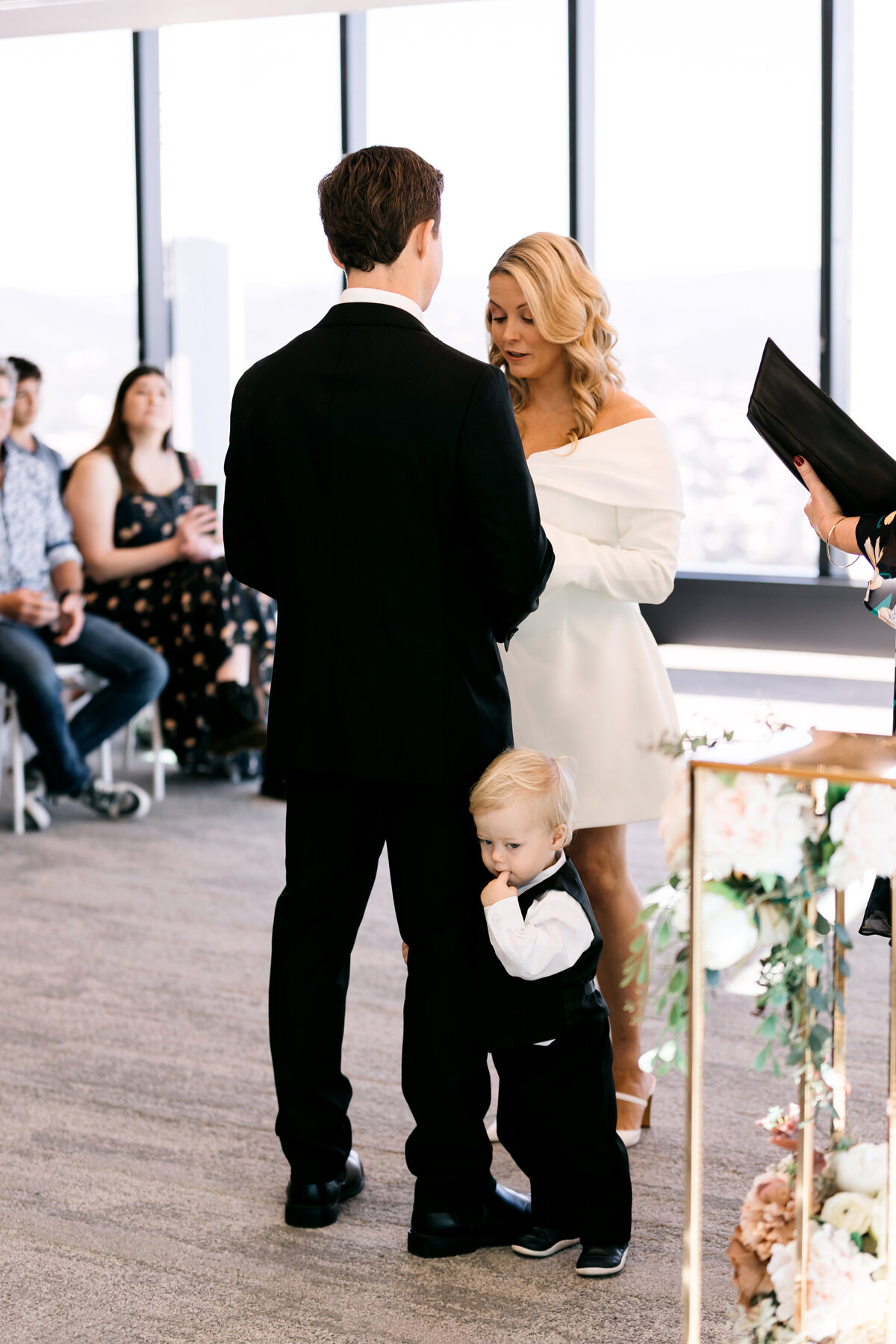 Bride and groom with their son during their wedding vows at the Brisbane Registry Office