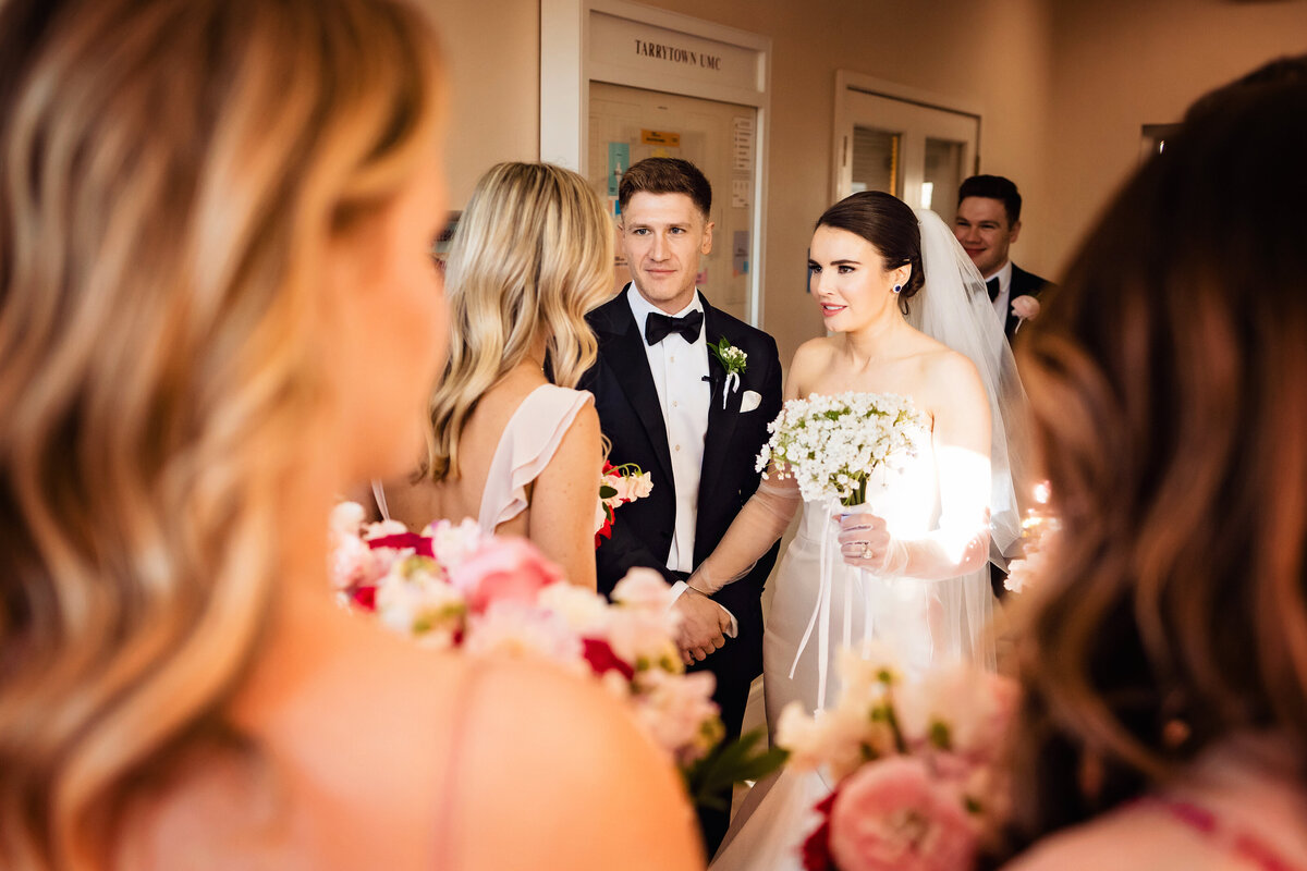 Immerse in joy at an Austin Country Club. Mesh gloves, couture gowns, lush florals, and a reception rager under bold uplighting – where luxury meets celebration.