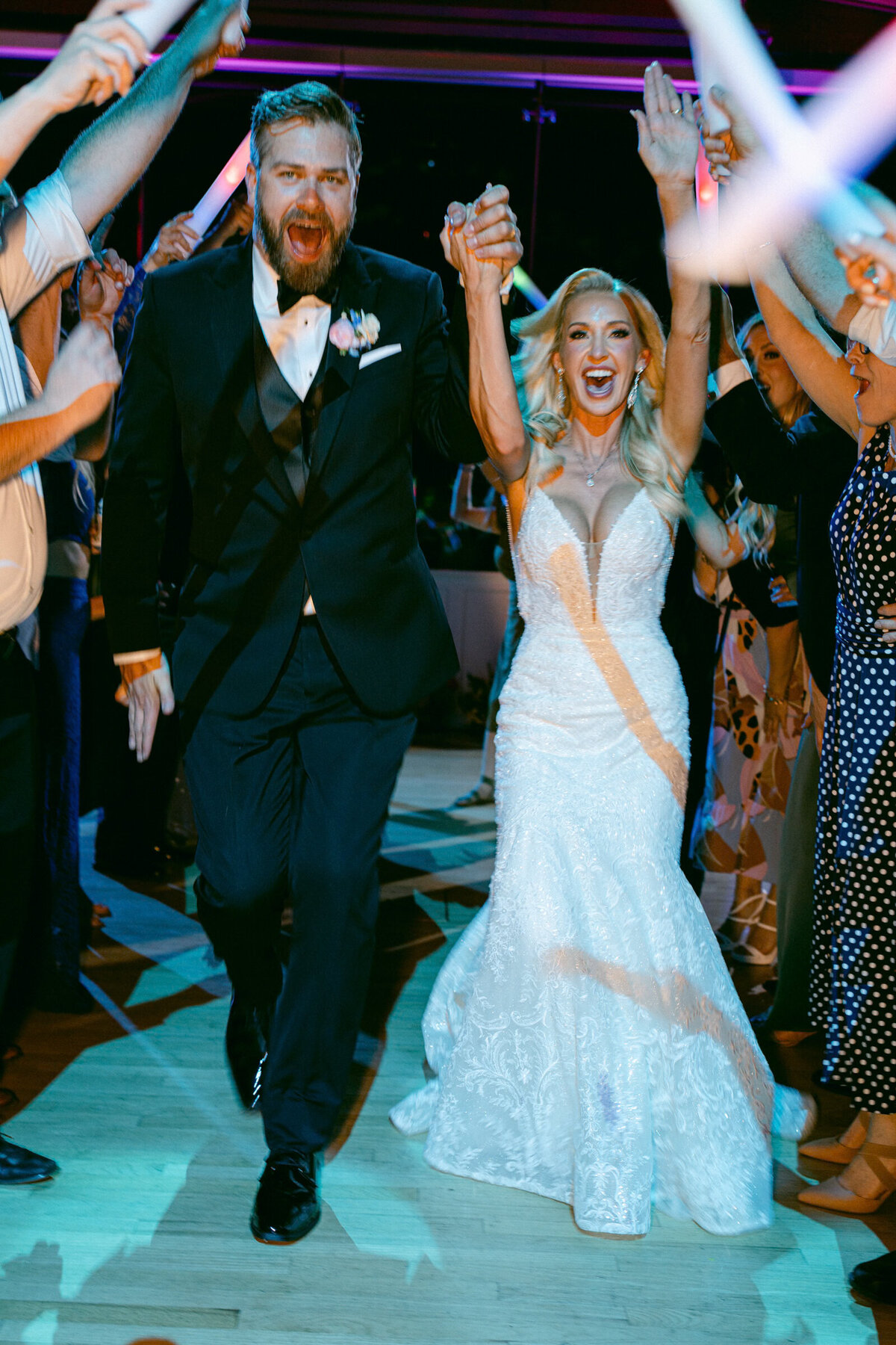 A wedding photo of the couples grand exit at Crystal Bridges Museum of American Art