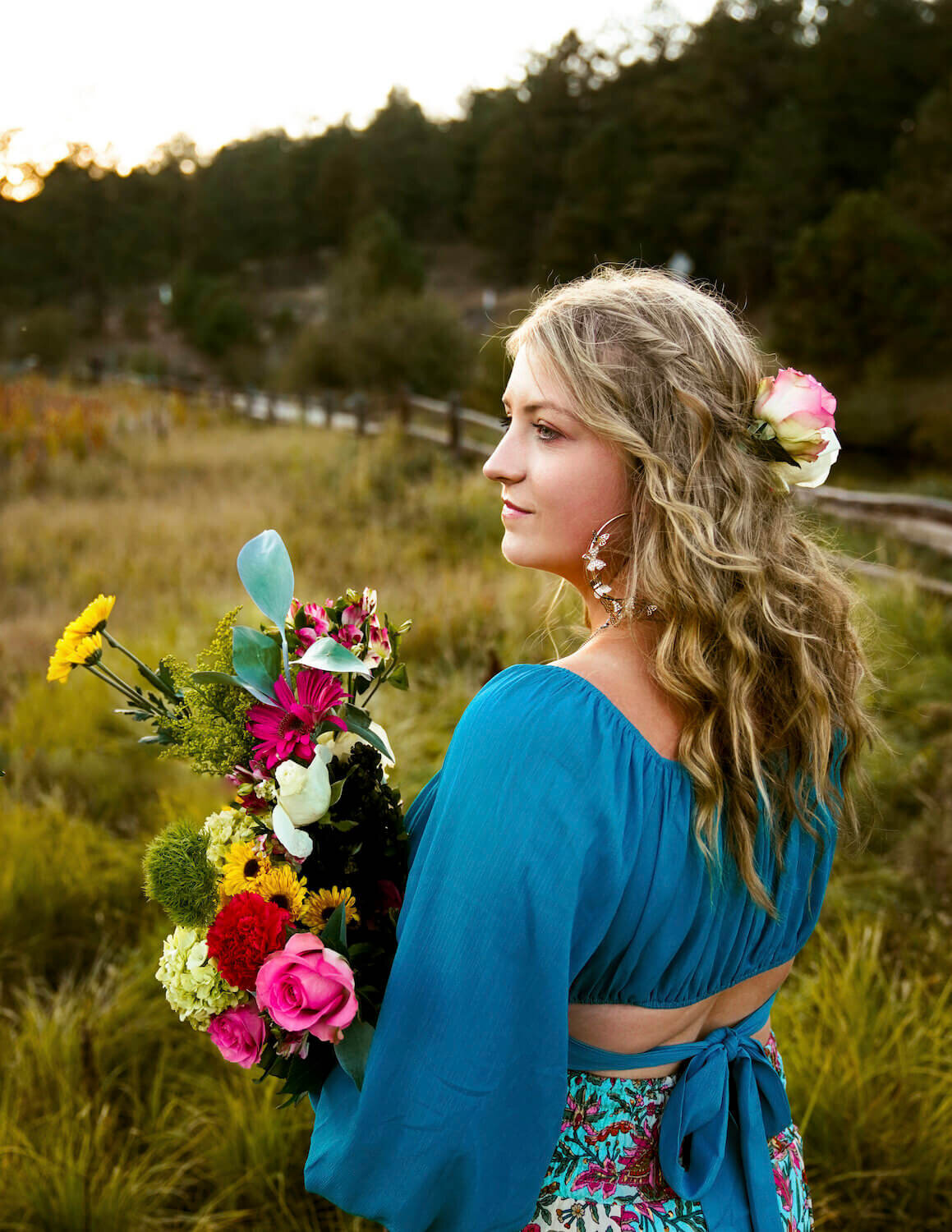 senior photography denver - teen girl in blue holding flowers