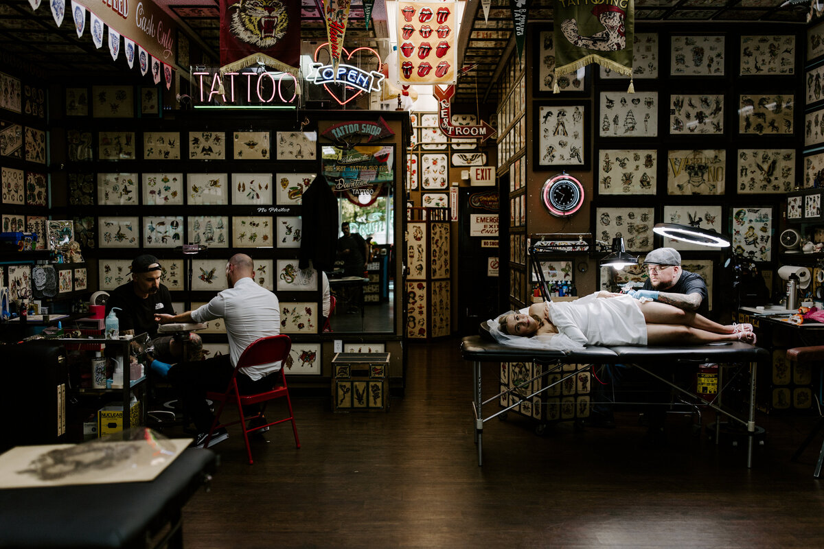 Two people get tattoos in Las Vegas on their elopement day.