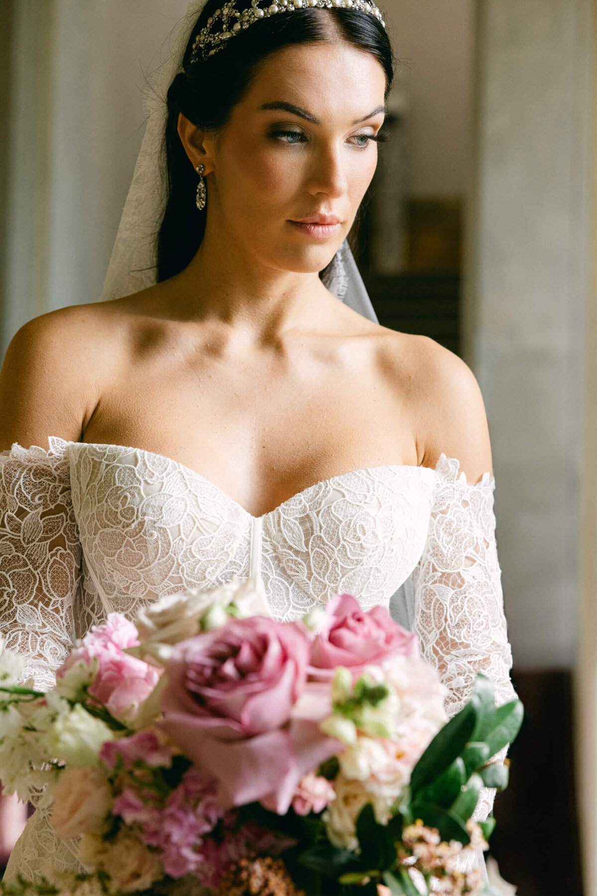 A wedding photo of  a bride in her white wedding dress at the wedding venue at Villa Balbiano on Lake Como in Italy