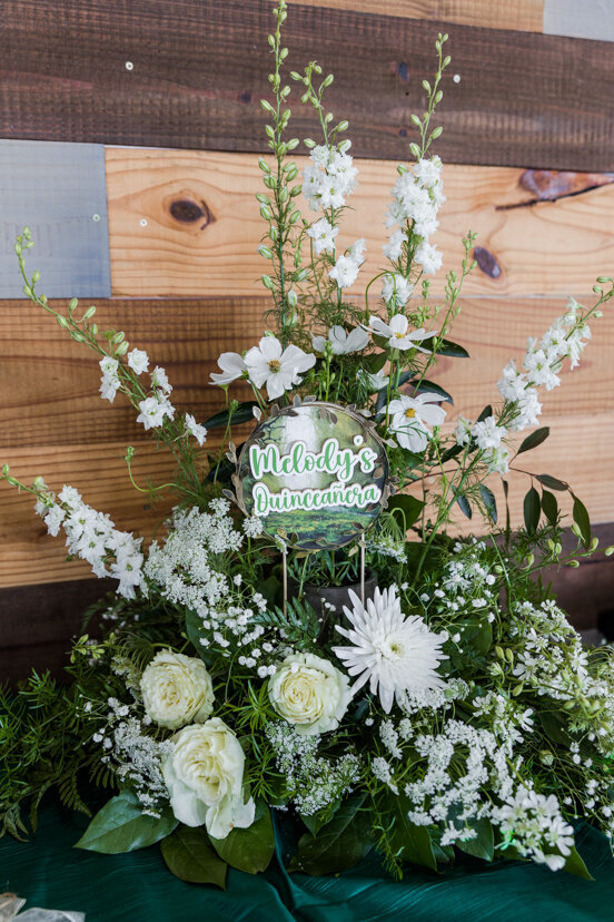 green-white-floral-arrangement-quinceanera
