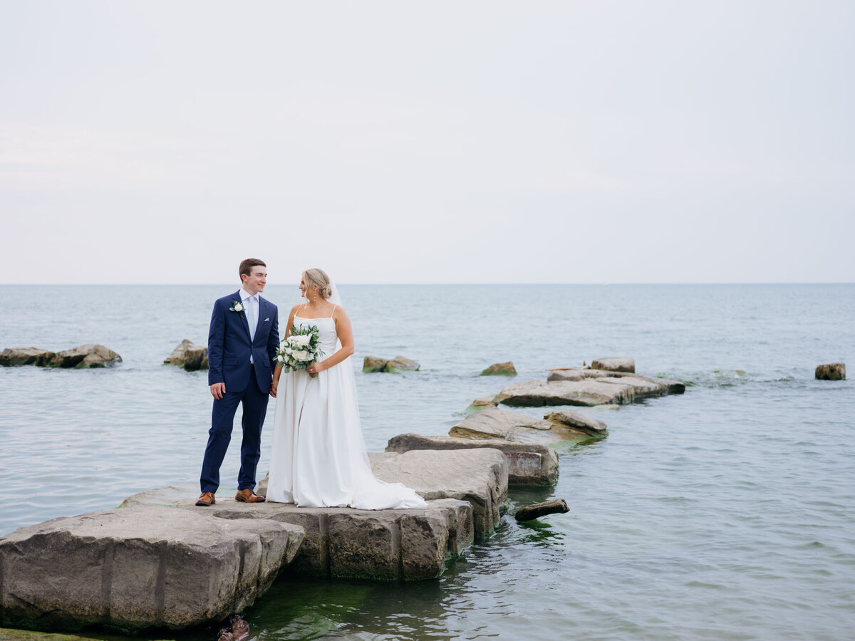 Bride and groom with lake in the background