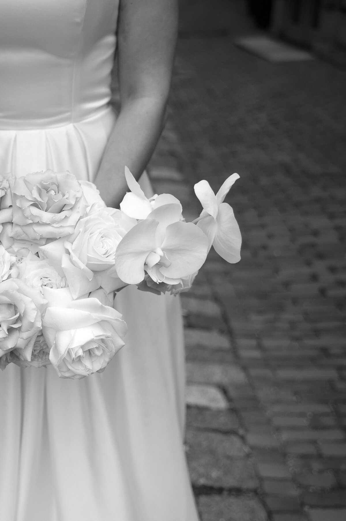 black and white photo of bride holding a flower bouquet