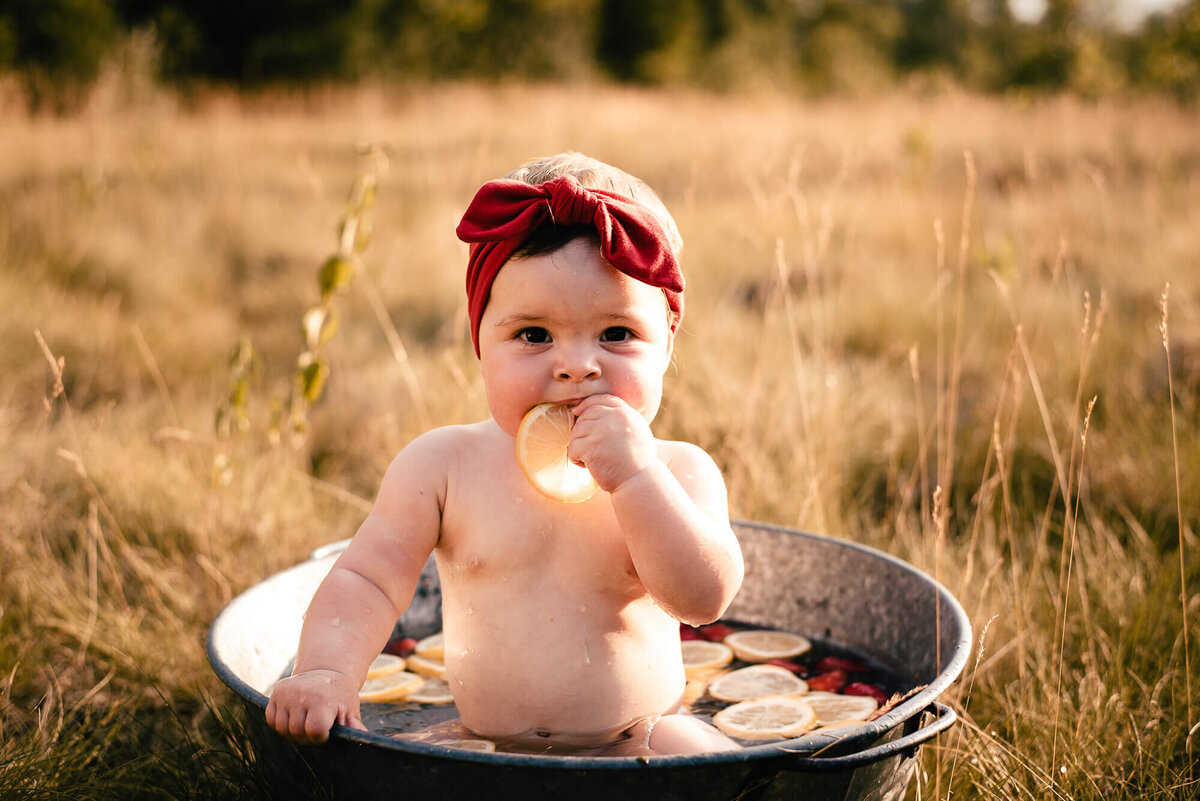Baby eating a lemon for Toronto family photo session