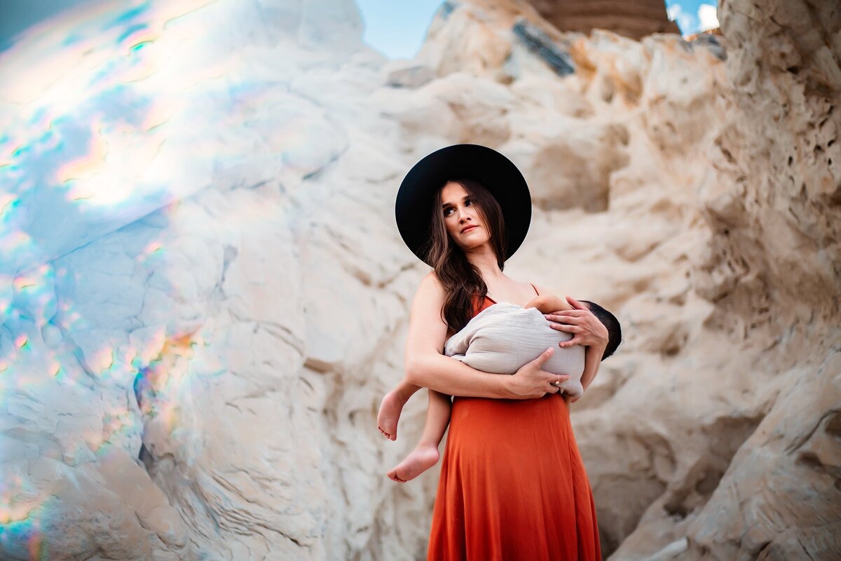 woman breastfeeding child photo