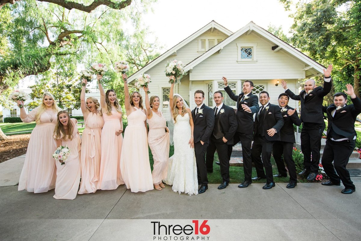Bridal Party celebrates with the Bride and Groom during photo shoot