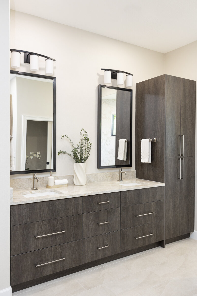 dewine design interiors windermere full house renovation bathroom with black framed mirrors and dark cabinets