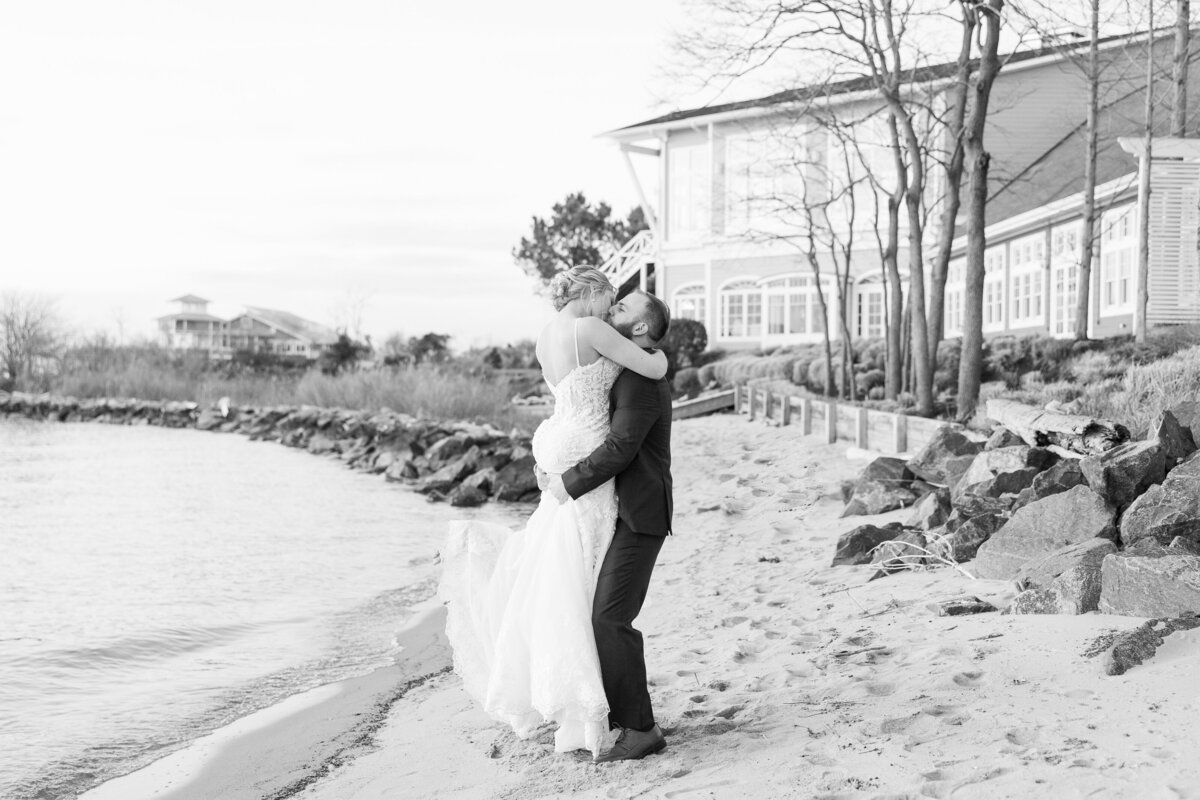 couple kissing at beach sunset chesapeake bay beach club