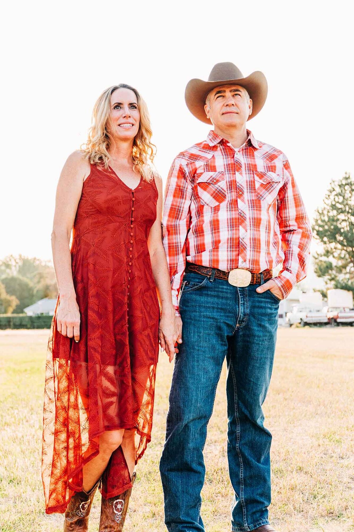 Engagement photo of Montana couple holding hands at Travelers' Rest State Park, Lolo