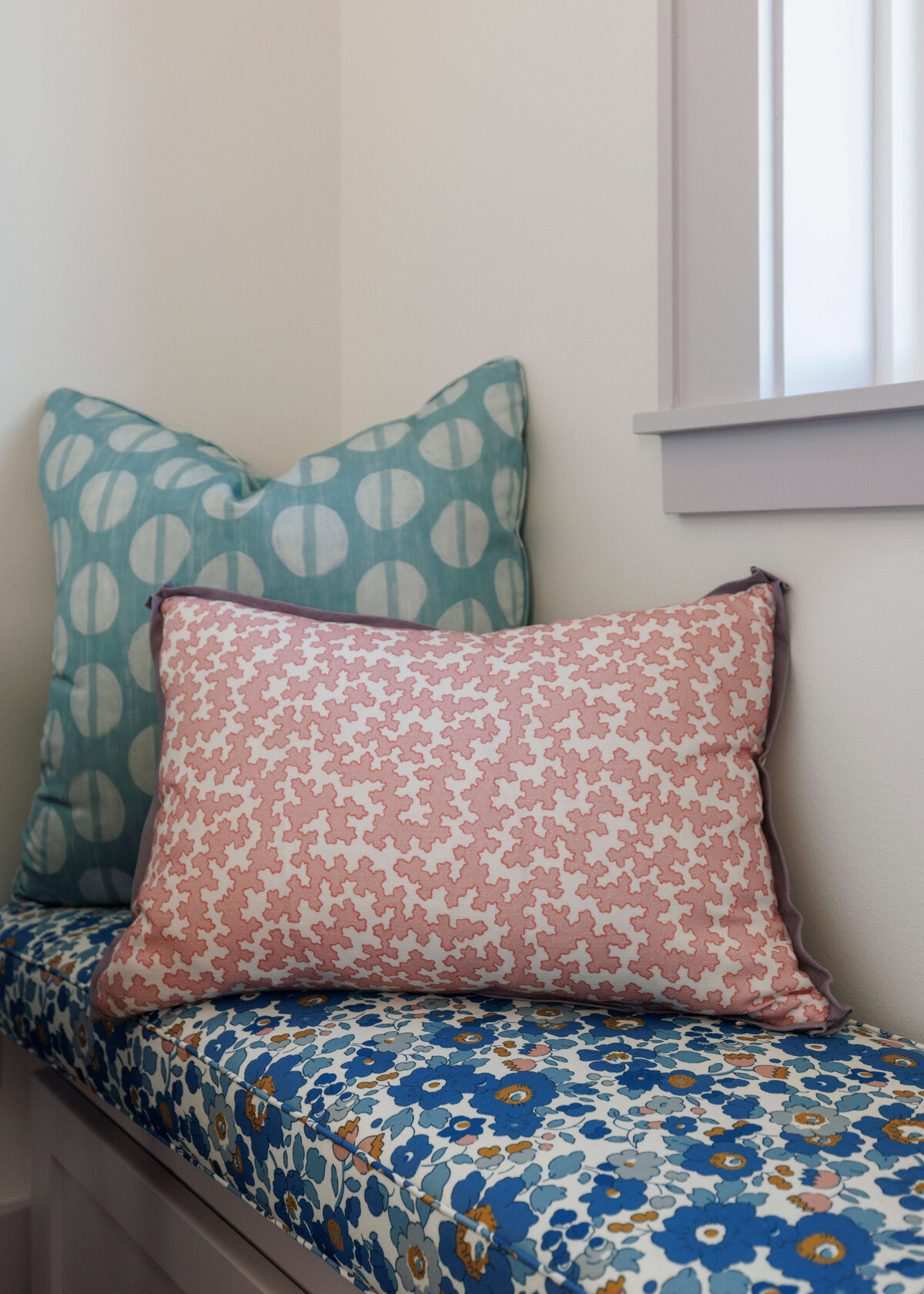 oyster creek studios lighthouse on the lake window bench with floral cushion and pink and light blue pillows