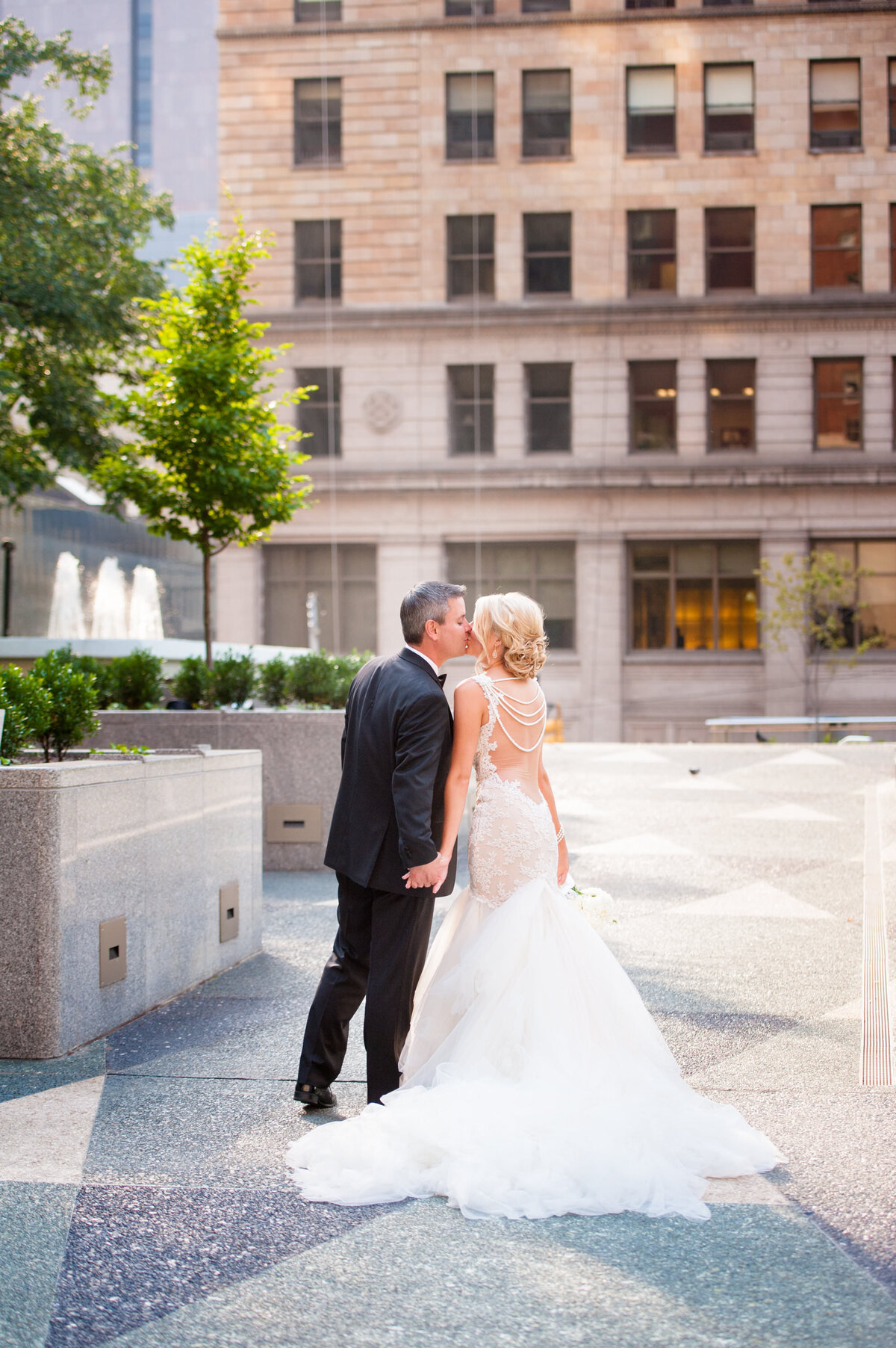 married couple kissing outside of omni hotel pittsburgh