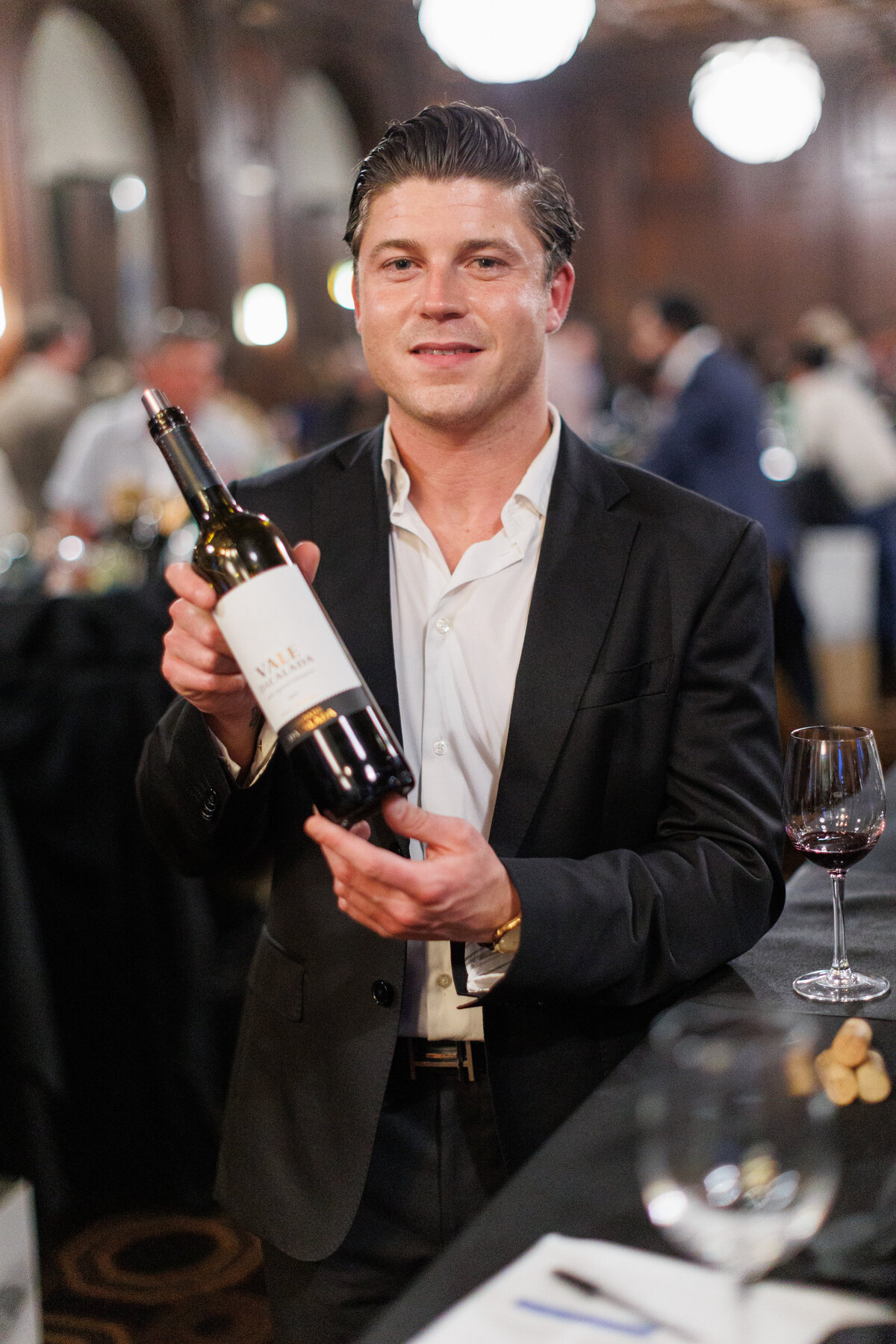 A man holding a wine bottle