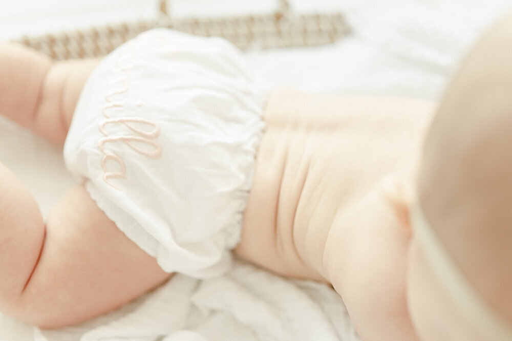 A baby's stomach rolls in kristie lloyd's nashville photography studio