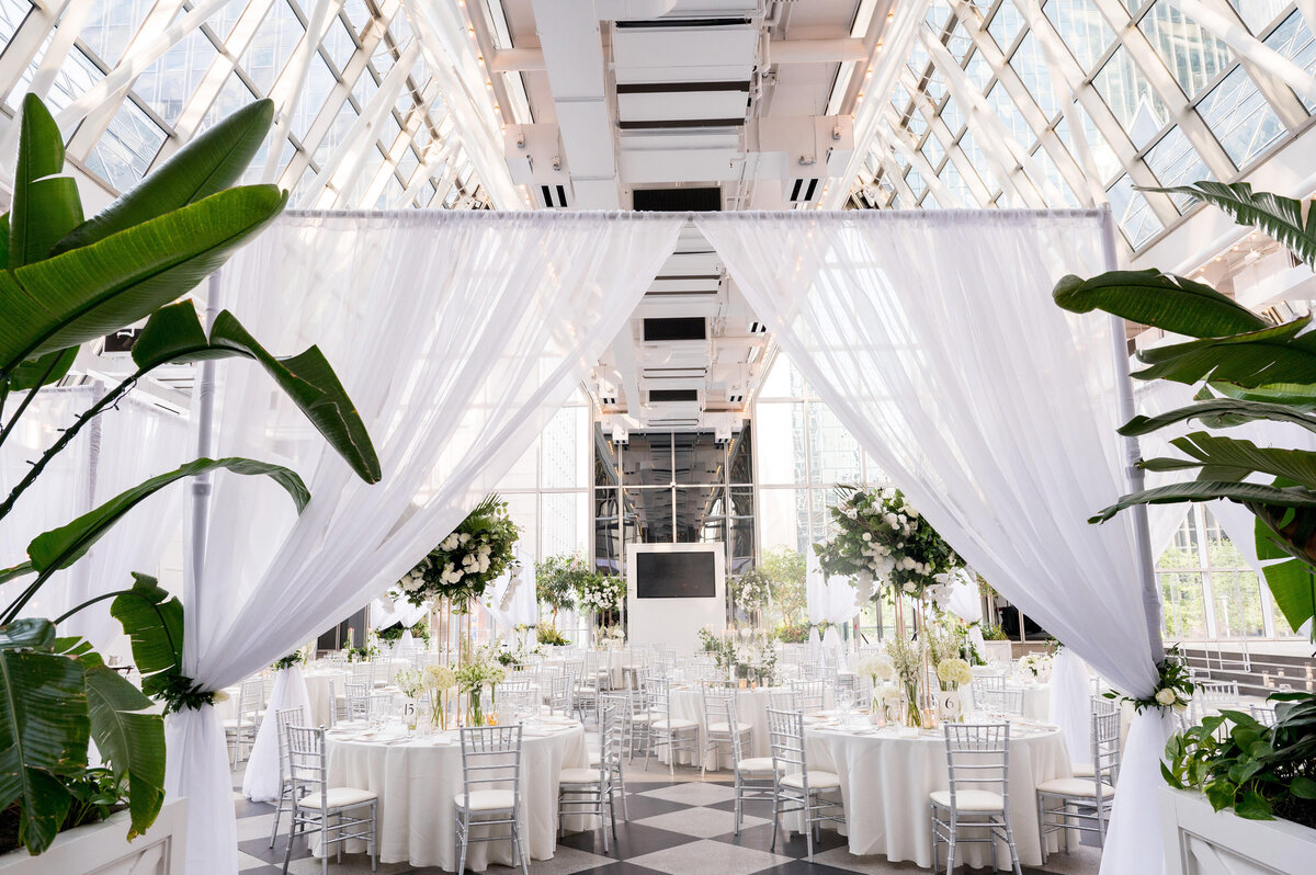 wedding reception designed by day of pgh wedding planners at wintergarden ppg place