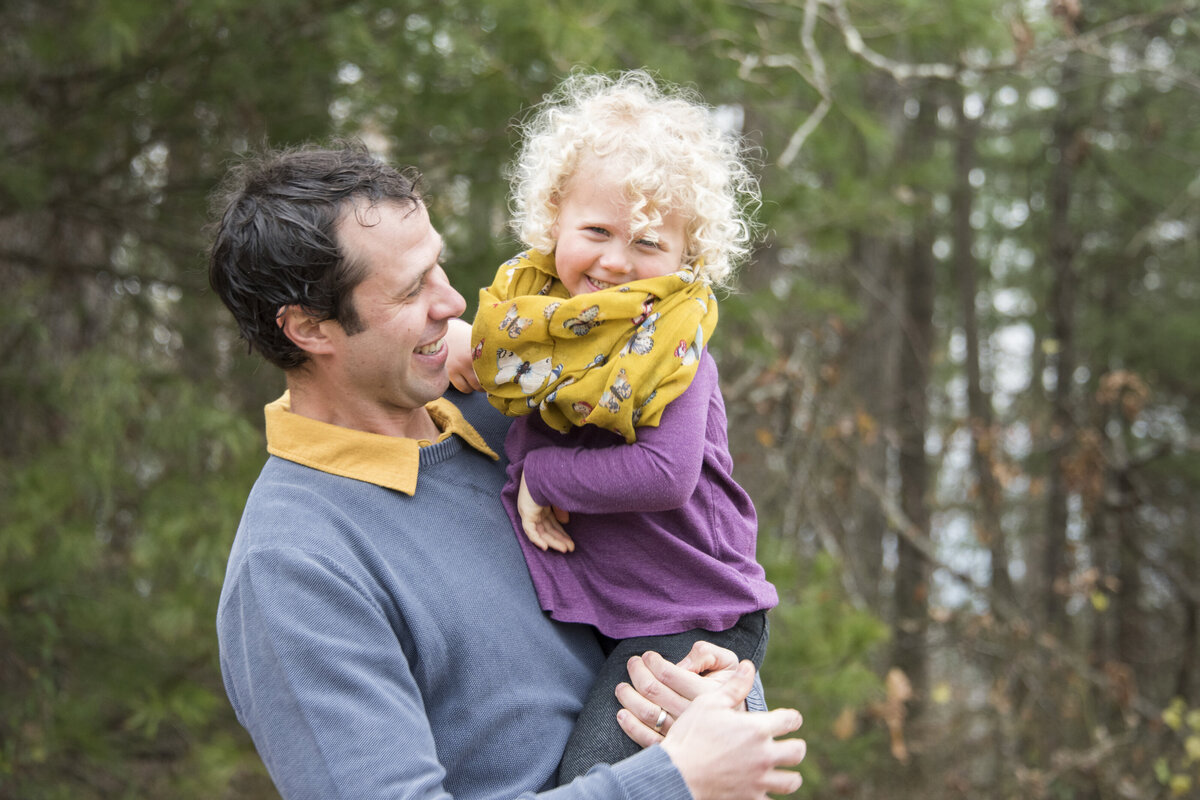 Dad and daughter laughing winter family photography Hendersonville NC