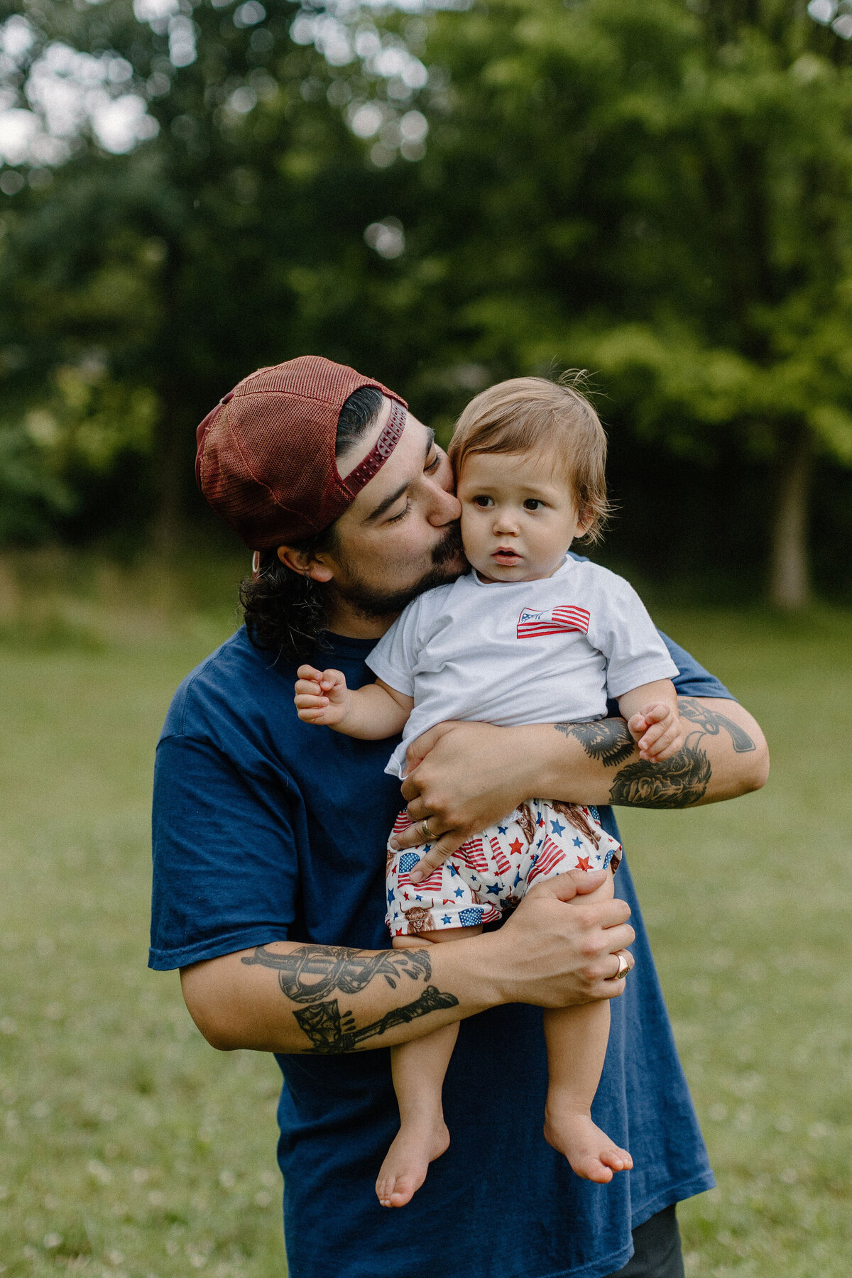 dad kissing son