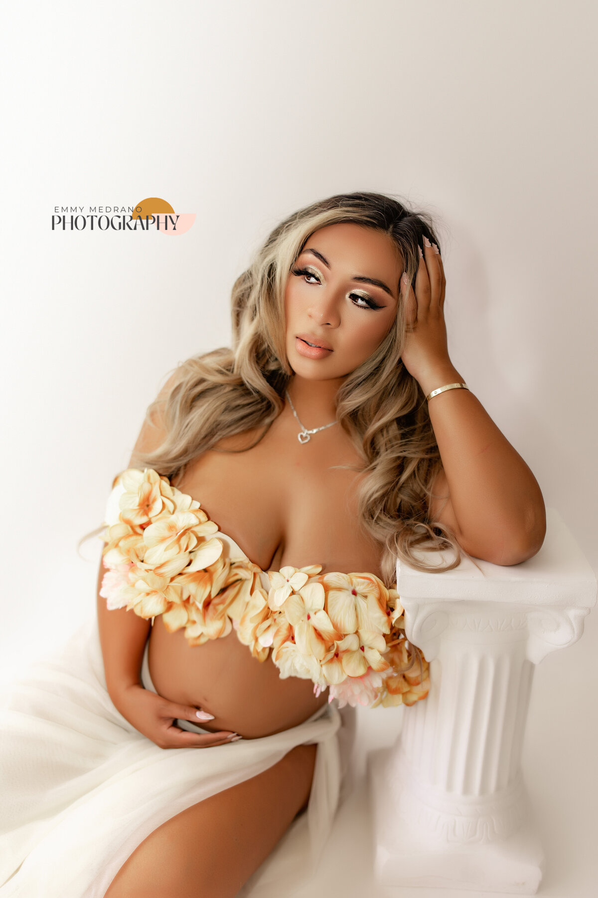 maternity session with flower bra sitting down san francisco maternity photographer