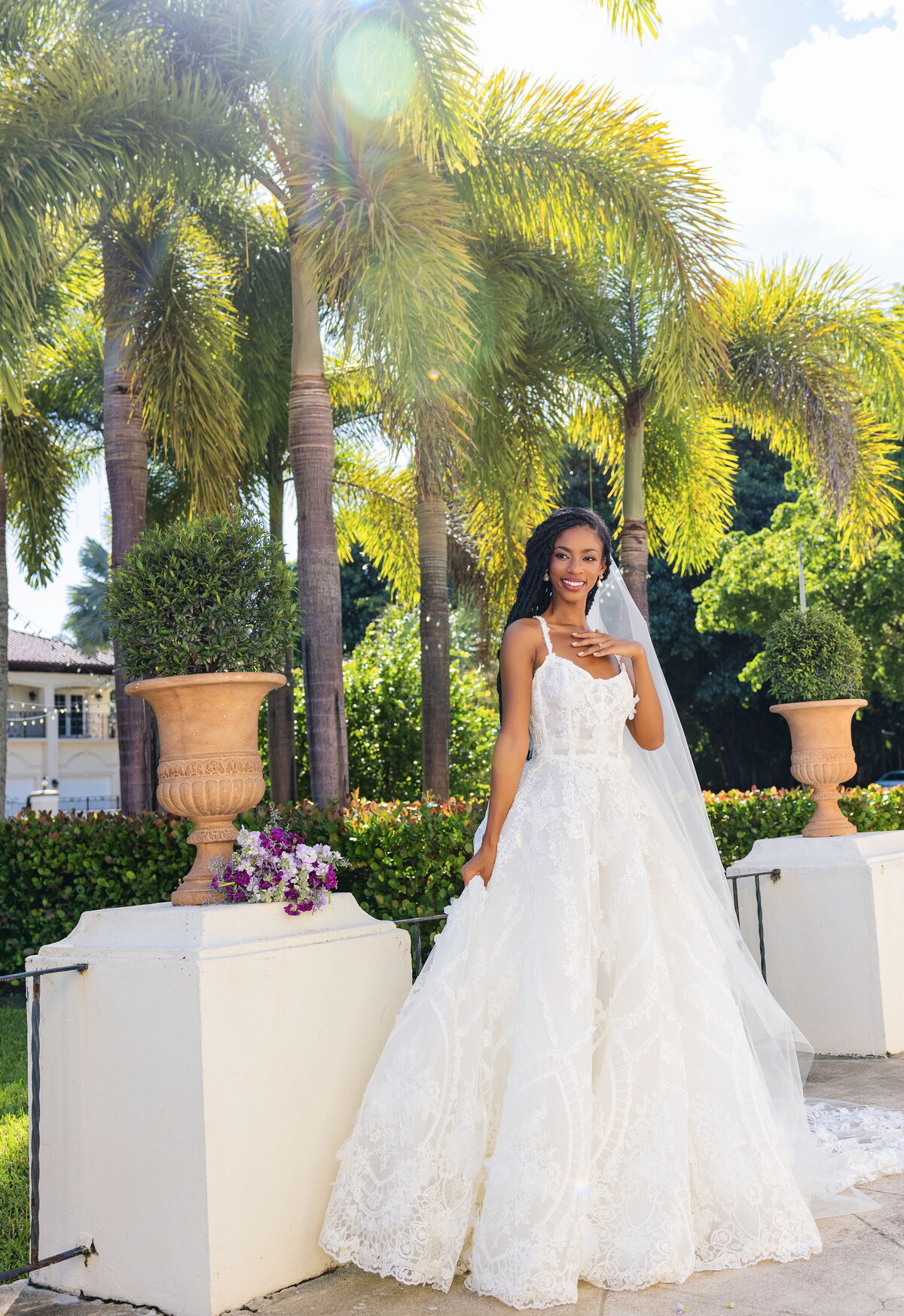 bride posing with trees