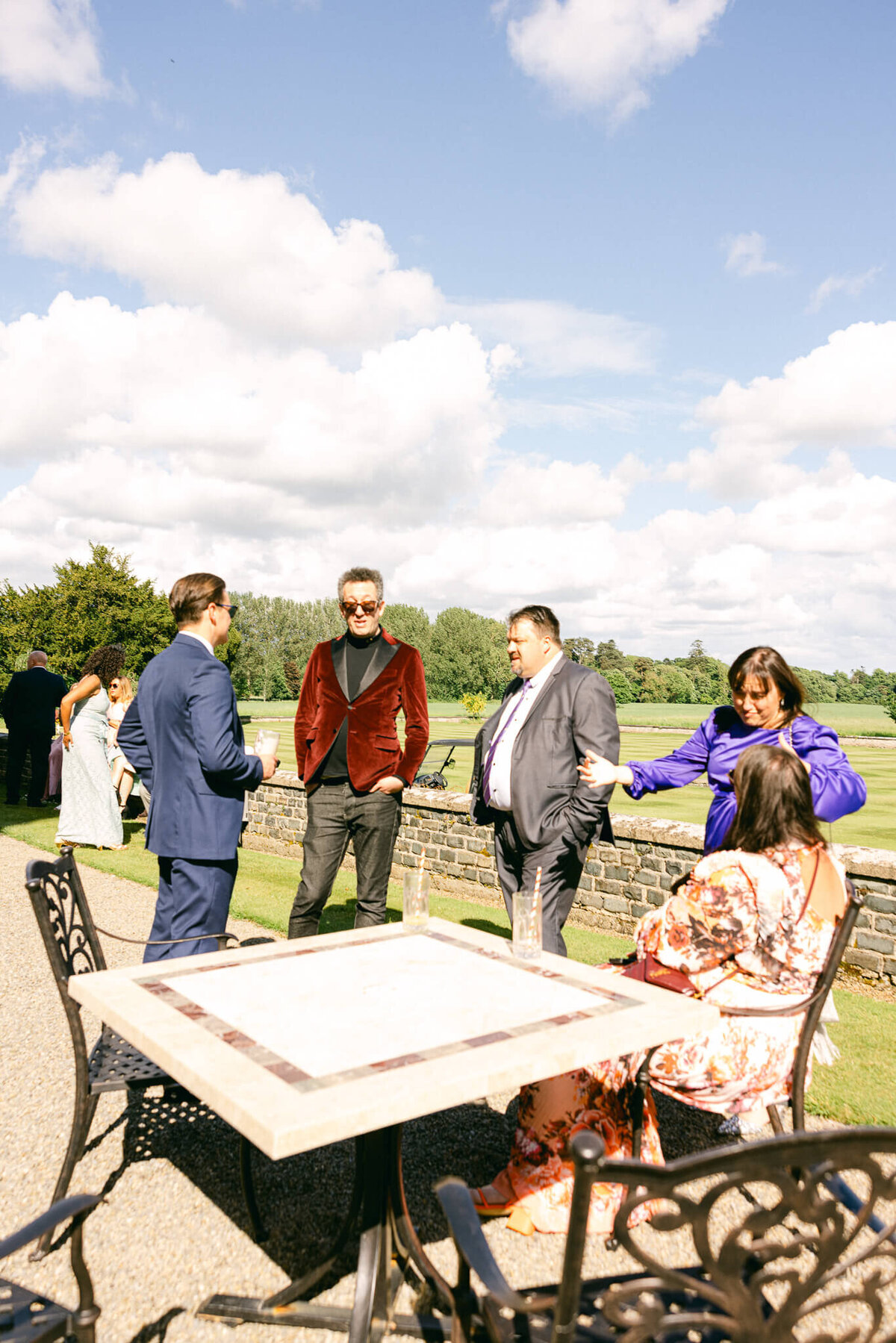 A wedding photo of guests during cocktail hour at Luttrellstown Castle in Ireland