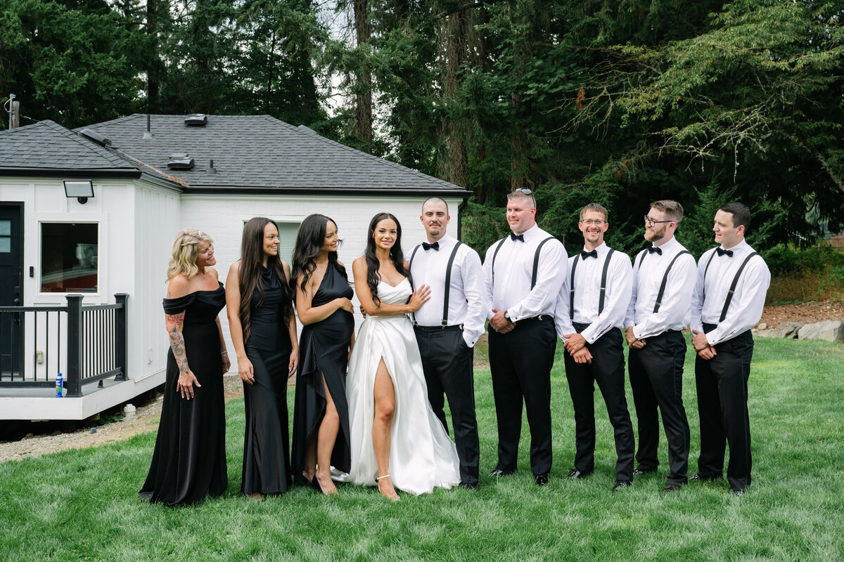 wedding party portraits black dresses and tux 