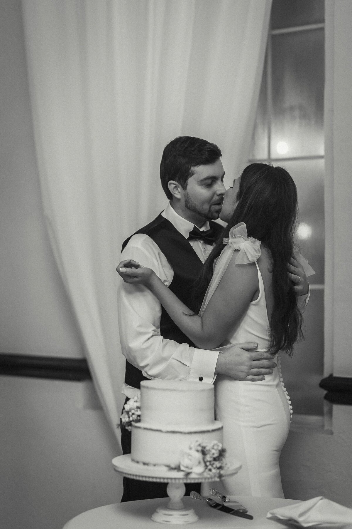 This intimate cake-cutting moment at Casa Marina was captured by Phavy Photography, a Jacksonville documentary wedding photographer. Shot in black and white, the image highlights raw emotion and connection without distraction. Phavy’s candid approach allows couples to relive the honest, unscripted moments that make their wedding day unforgettable.