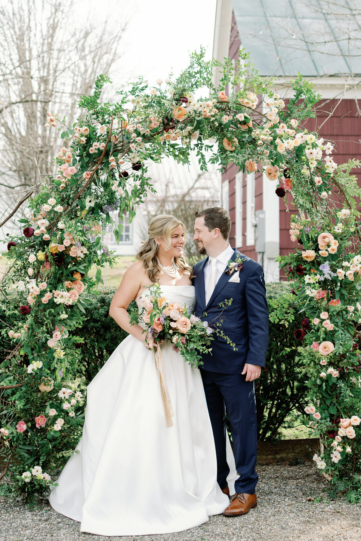 grafton inn wedding ceremony and arch with flowers
