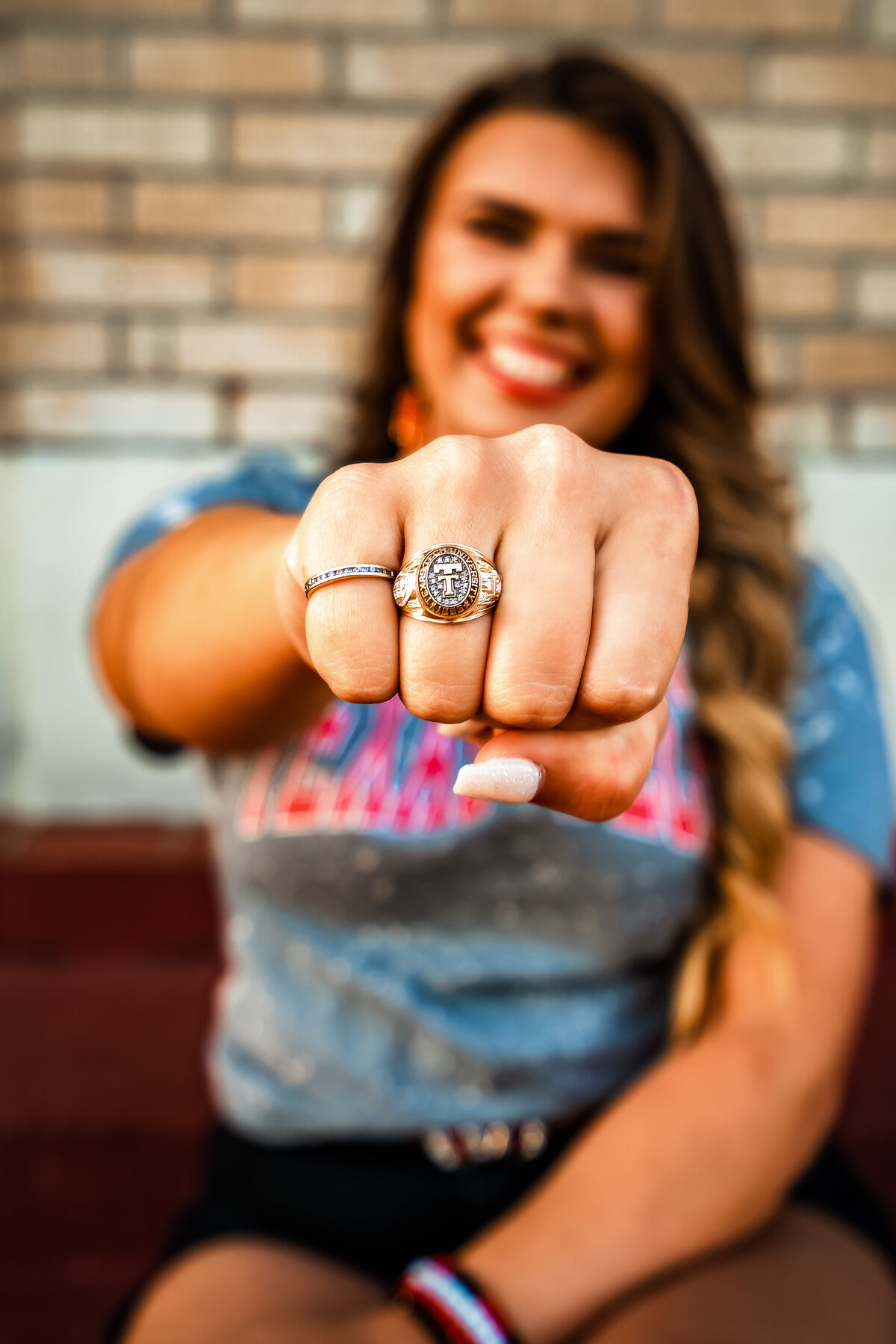College senior showing class ring