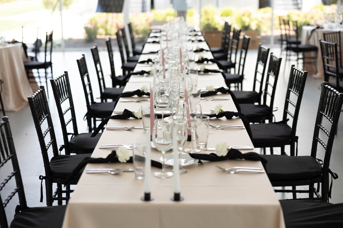 head-table-candles-black-chairs-reception-design