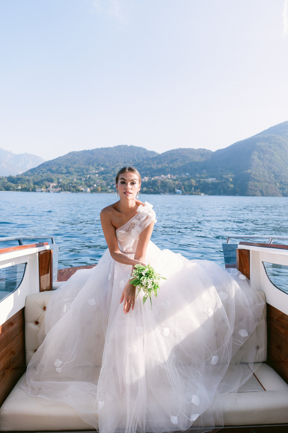 Bride on a private boat on lake como, italy