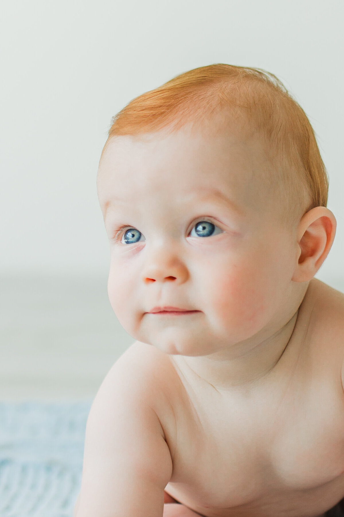 Close up of a toddler with blue eyes