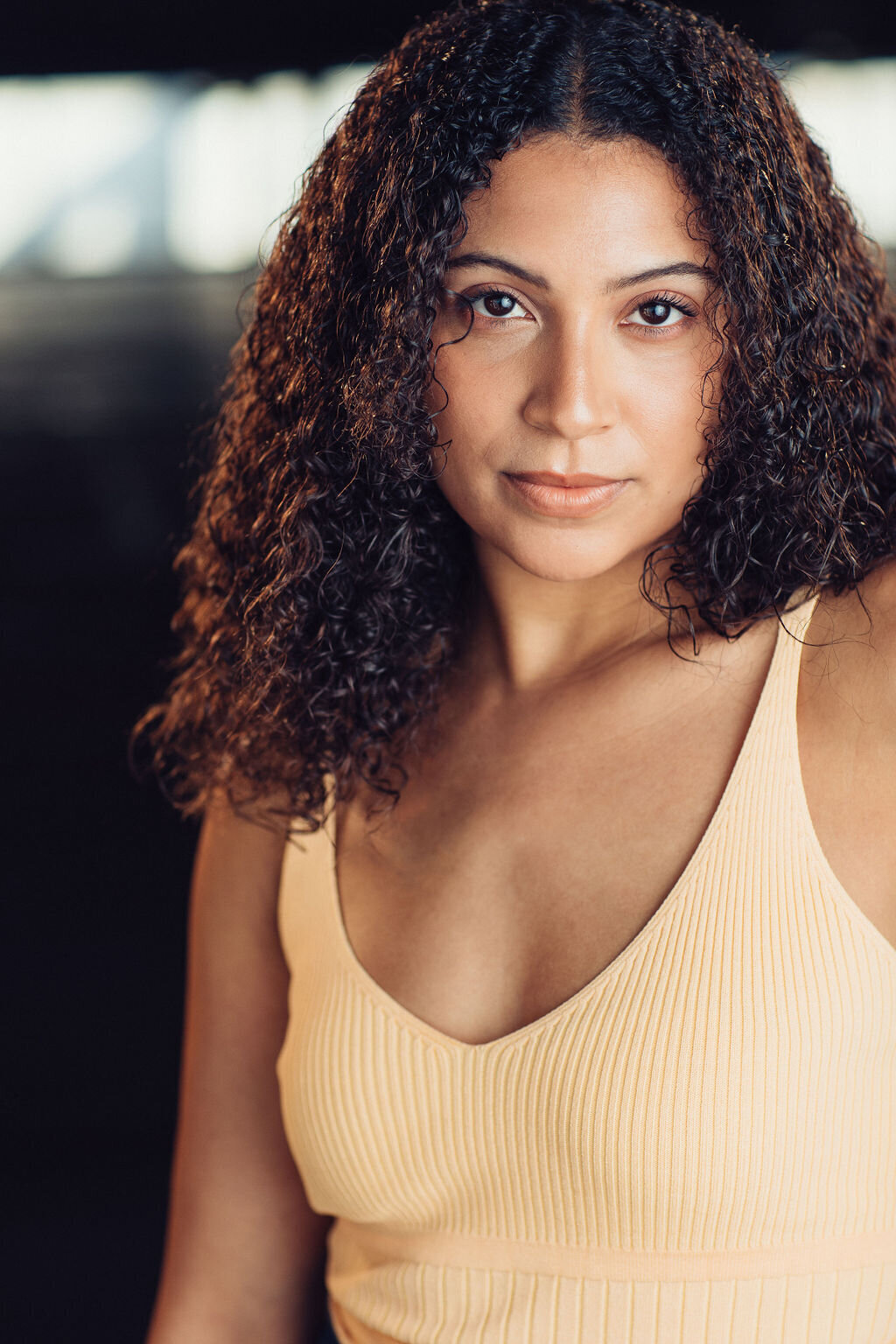 Headshot Photograph Of Young Woman In Light Yellow Sleeveless Los Angeles