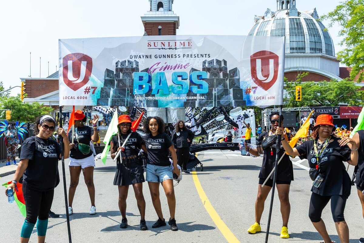 Toronto caribbean carnival parade masquerader in costume with Sunlime Mas, the number 1 medium size band at Toronto Carnival.