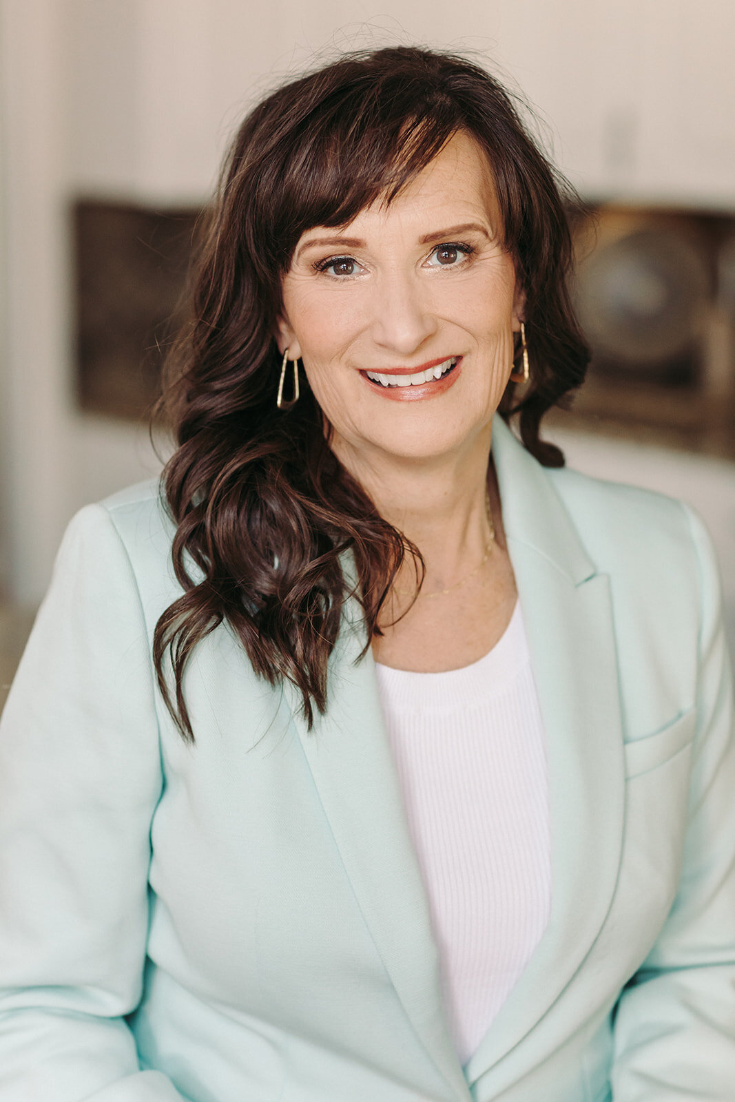 Utah Family Photographer captures woman wearing white smiling during brand photography session
