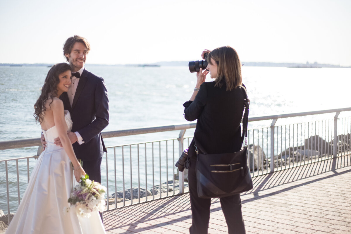 Leslie photographing a bride and groom