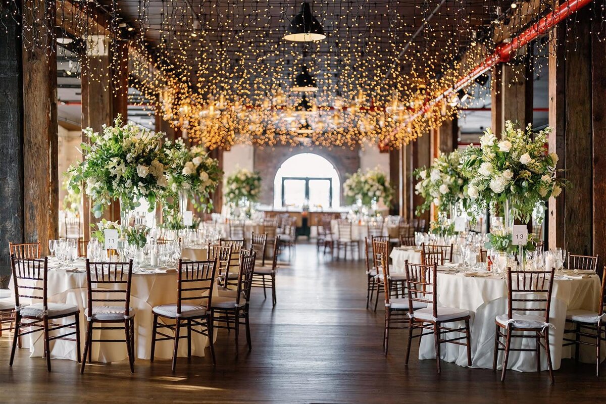 romantic reception with white flowers and lights