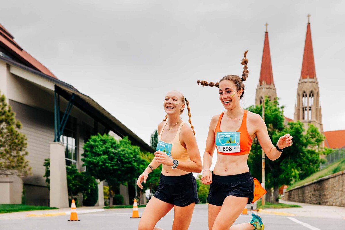 Two happy girls running in Governor's Cup Race, Helena, MT