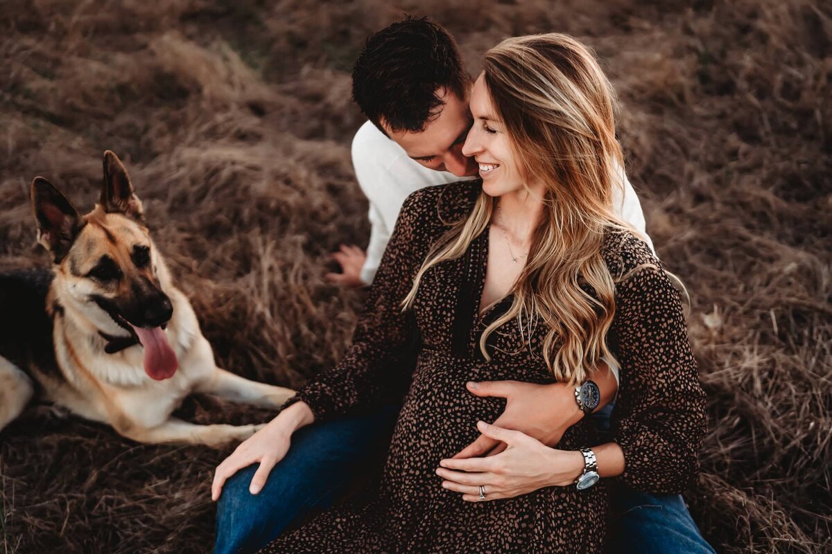 San Diego Maternity Photographer captures couple sitting on blanket together during maternity photos