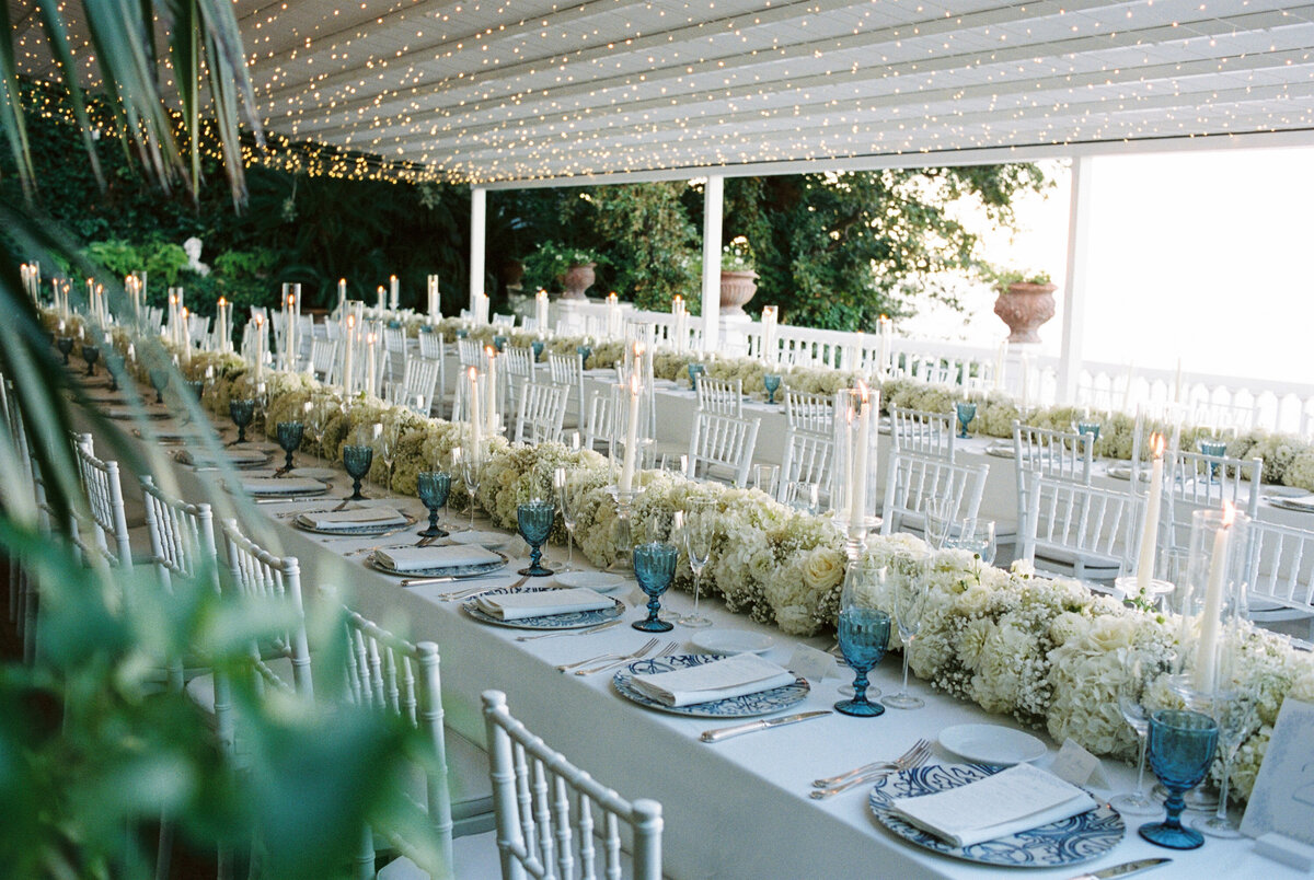 the wedding reception dinner area dressed with candles and sorrento decor