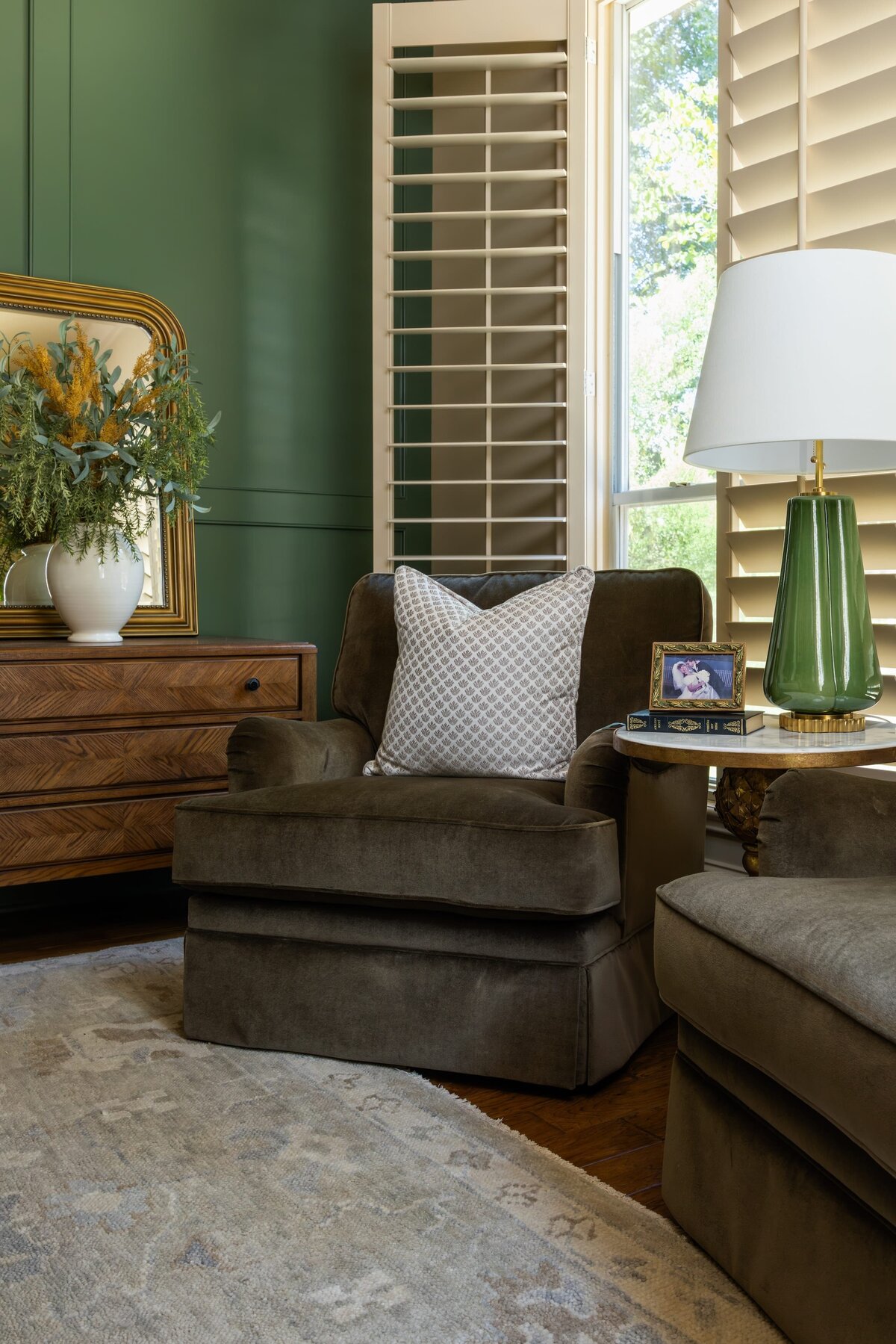 kyleen bushroe interiors coverdell master bedroom with brown chairs and accent rug