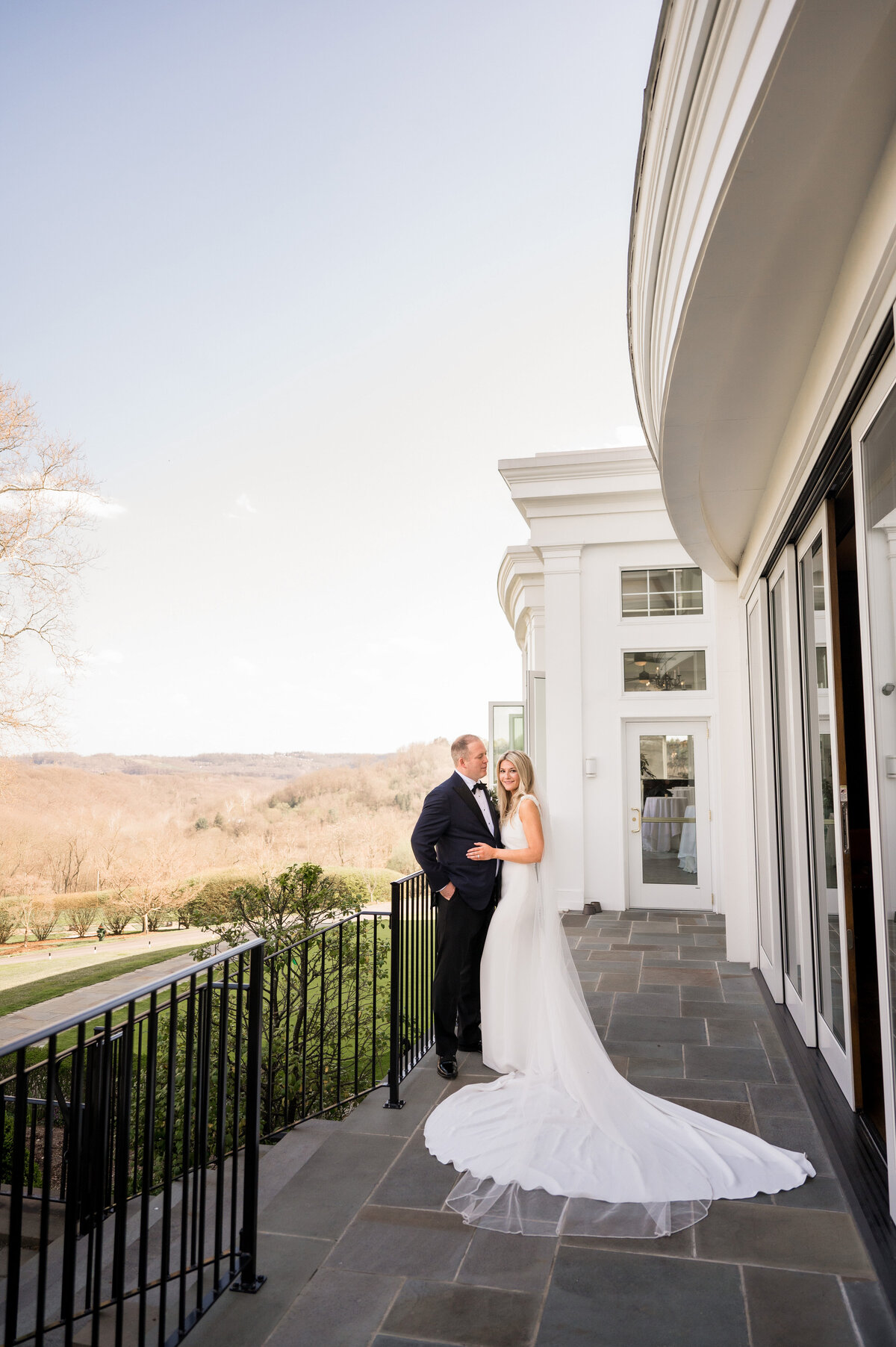 photo from a pittsburgh field club wedding on the back veranda overlooking the golf course