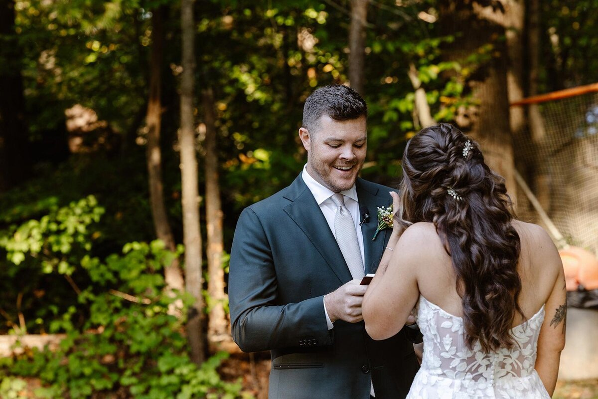A groom reading his vows to his bride on their wedding day