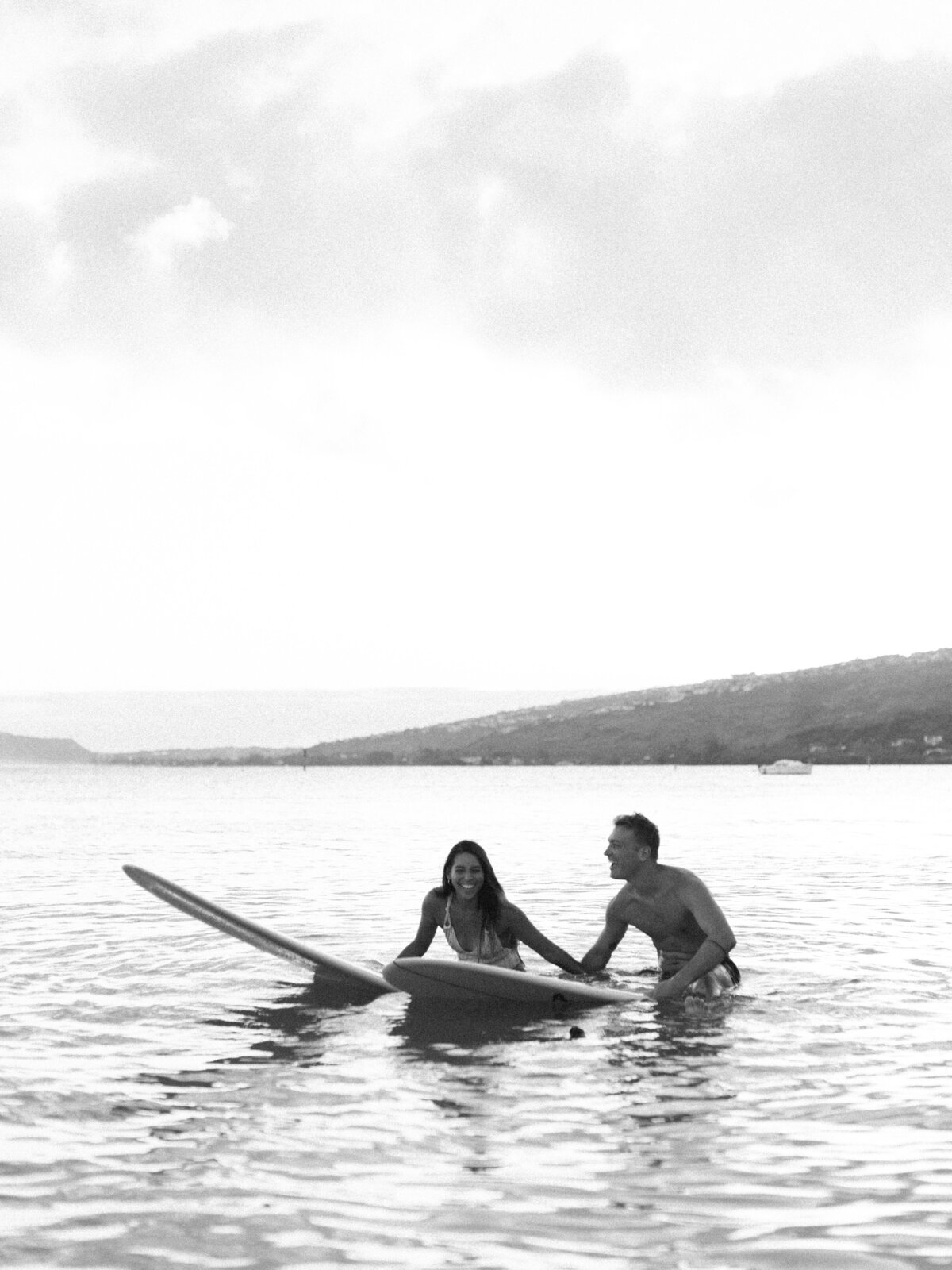 black-and-white-couple-on-surfboards