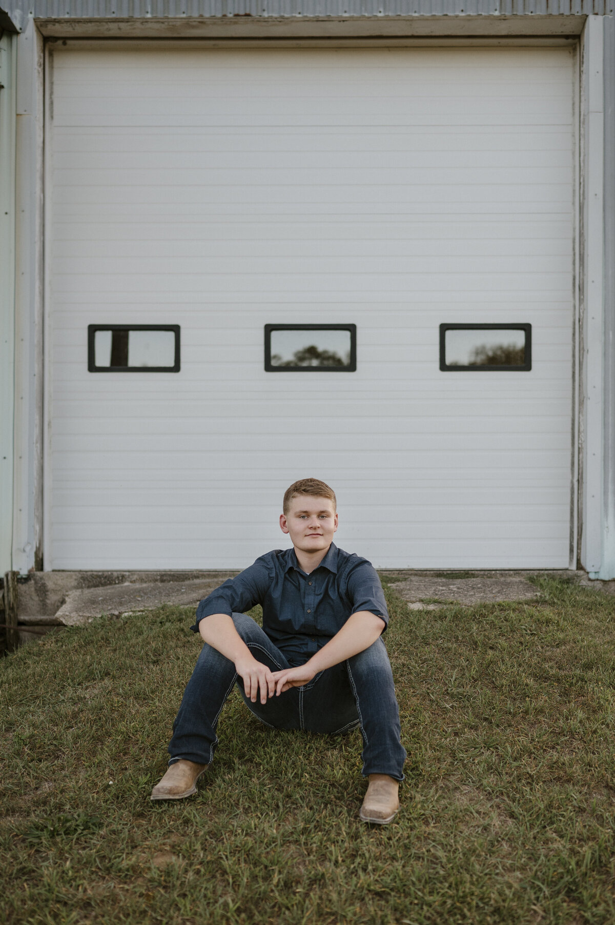 Boy sitting on grass